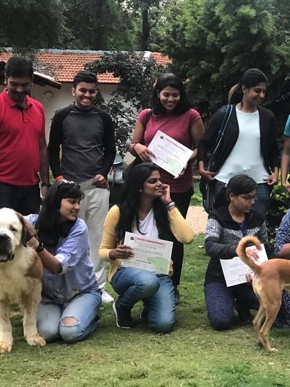 A group photo from a weekend workshop, complete with a beautiful Saint Bernard and a friendly Indie.