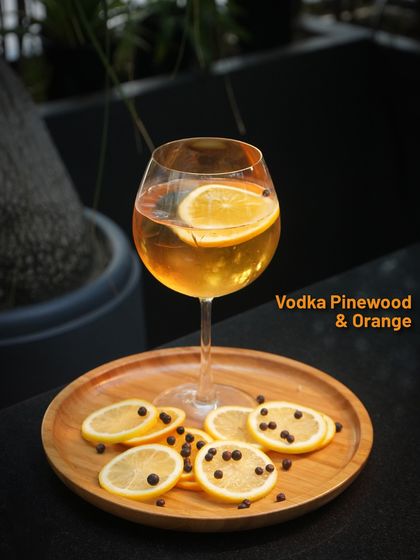The Vodka Pinewood & Orange from our Pernod Ricard promotional menu. A refreshing and aromatic cocktail with earthy notes from the pinewood.