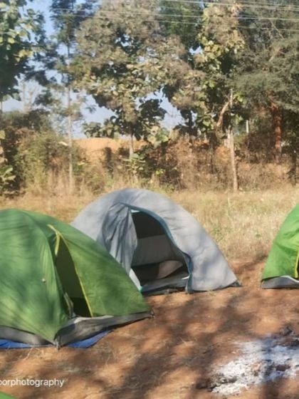 Our tents pitched in the morning light. Camping is a core part of this weekend adventure.
