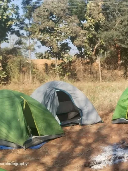 Our tents pitched in the morning light. Camping is a core part of this weekend adventure.