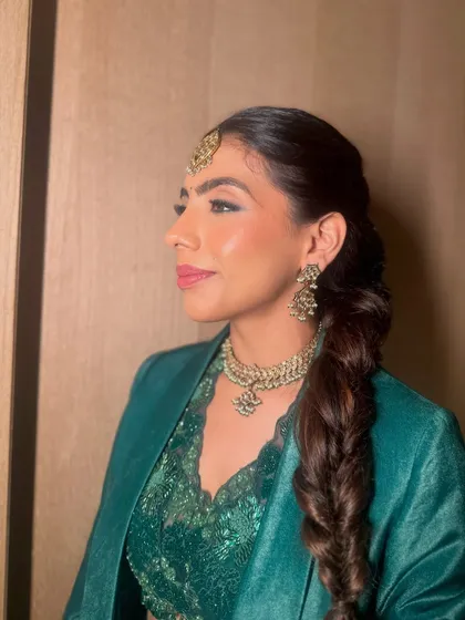 The final look: a sleek, modern braid that is both stylish and comfortable. The maang tikka adds a touch of traditional glamour.