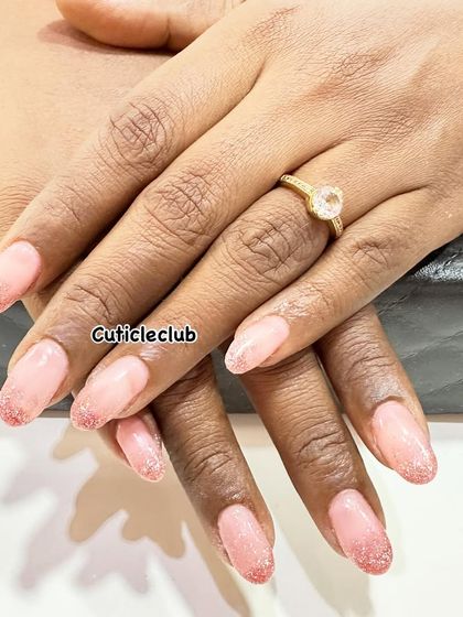 A subtle pink ombre with a fine glitter fade at the tips. This is a beautiful and elegant choice for any occasion.