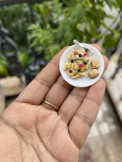 The magic is in the details! My miniature food sculpting classes are where you can learn to create incredibly realistic, tiny treats from clay. This little plate of pasta is a great example of the fun and focus that goes into making these adorable charms.