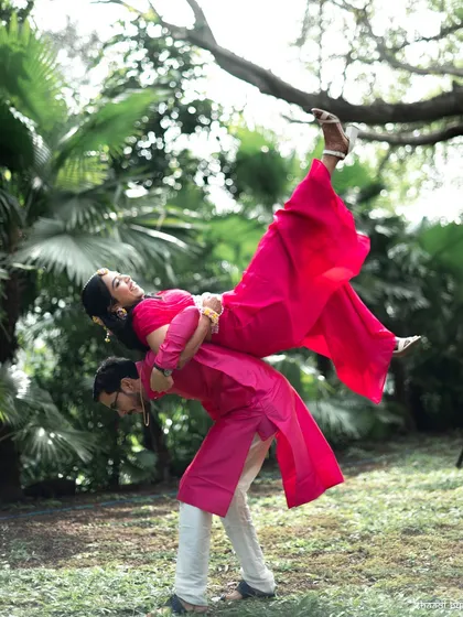A fun and acrobatic lift! This couple wasn't afraid to get playful during their haldi portraits.