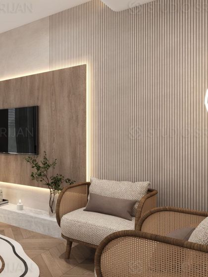 A close-up of the TV wall, showing the combination of fluted panels, a wood-finish backdrop, and a floating marble-top console.