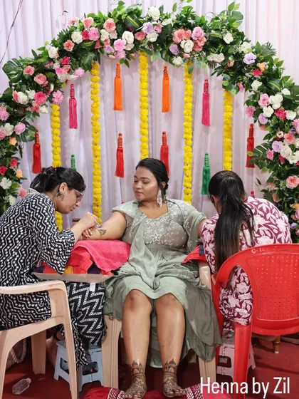 A full view of the mehendi setup, with me and my team working on the bride and her family.