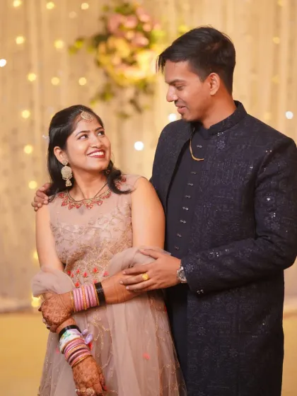 A candid moment of the couple sharing a look of love and happiness during their engagement celebration. These are the natural interactions we strive to capture.