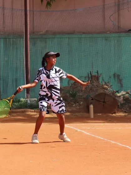 A young player making contact with the ball out in front. This is a key element for generating power and control.