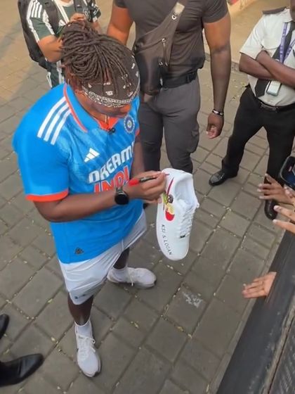A shot of KSI autographing the custom sneakers we designed. The shoe features themes from his ventures, including Prime and Feastables, making it a unique collector's item.