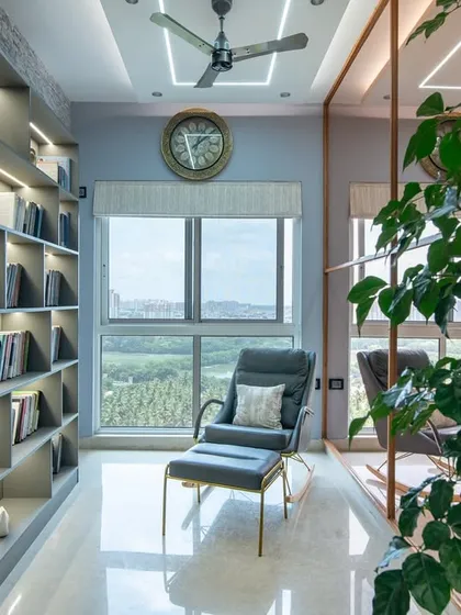 This reading corner at SNN Clermont transforms literature into luxury. A built-in bookcase with integrated lighting and a comfortable rocking chair create the perfect spot to unwind with a book.