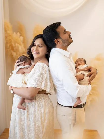 A duplicate of image 7, this pose is a client favorite. It's a stylish and emotional portrait that symbolizes the unity and love of the new family.