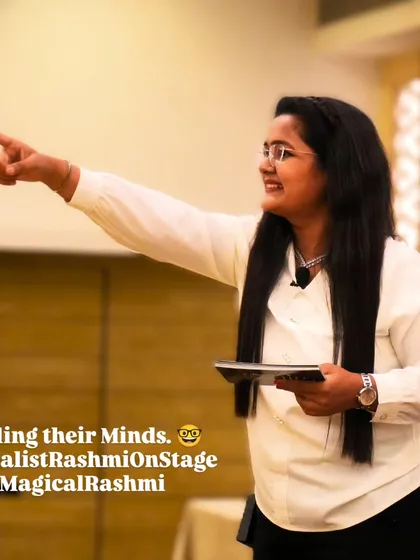 In this moment, I am connecting with an audience member during a corporate mentalism show. It's all about focus, engagement, and a little bit of mind-reading to create an unforgettable experience for professionals.