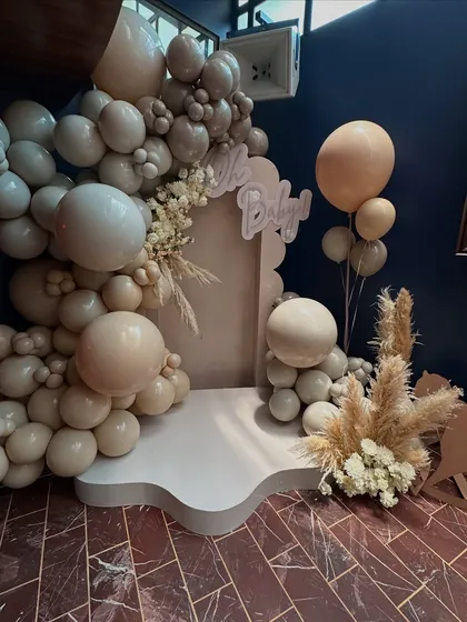 A wider shot of the photo booth, showing how the balloon installation creates a beautiful and inviting space for pictures.