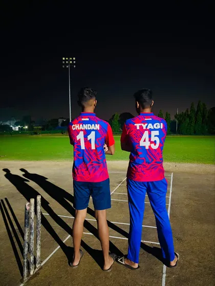 Two powerhouses, one battlefield, under the lights. Our players ready for a night match.