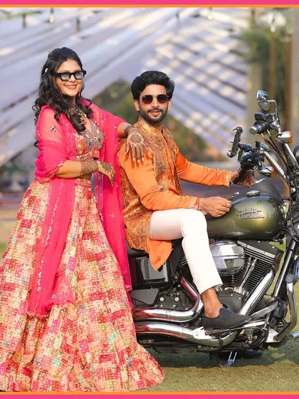 The couple posing on the bike, a perfect picture of modern love celebrating traditional rituals. We help you make every moment your own.
