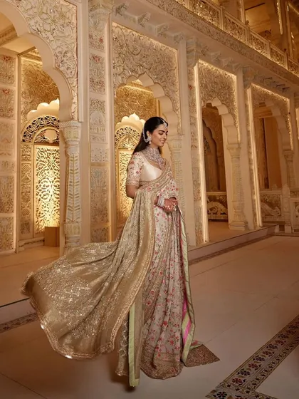 The full, flowing silhouette of Isha's floral Manish Malhotra saree. My goal with event styling is to ensure the client not only looks incredible but also feels comfortable and radiant.