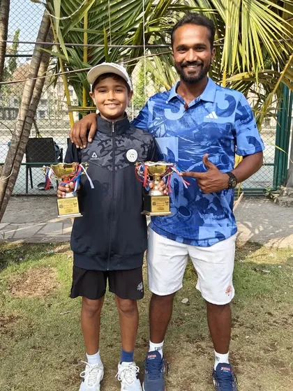 Aarav with his coach and his two runner-up trophies from the U-12 Nationals. We analyze every performance to turn runner-up finishes into wins next time.