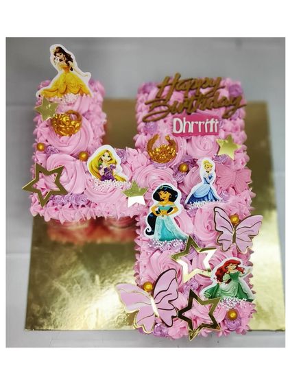 My first pull-apart cupcake cake, shaped into the letter 'H' for a 4th birthday. This princess-themed design is made with delicious chocolate cupcakes.