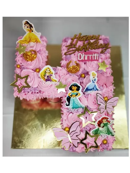 My first pull-apart cupcake cake, shaped into the letter 'H' for a 4th birthday. This princess-themed design is made with delicious chocolate cupcakes.