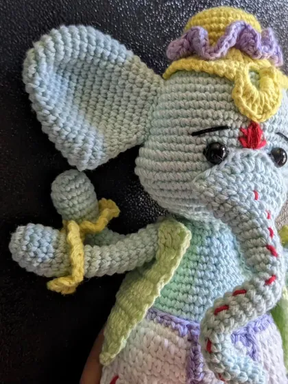 A side-view close-up of the Ganesha doll.