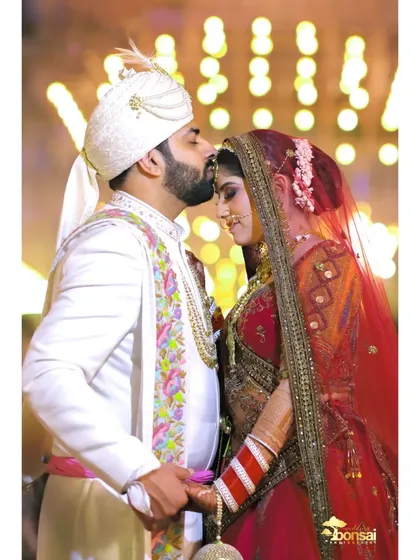 A tender kiss on the forehead. These quiet, intimate moments amidst the grandeur of the wedding day are what make your story truly personal.
