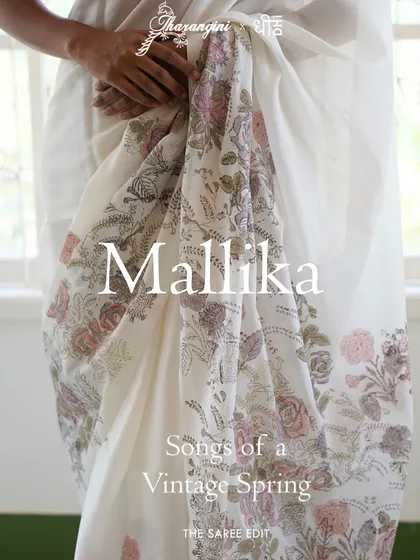 The Mallika saree is a breath of fresh air, crafted in custom linen with a woven border. Its design features a joyful bouquet of vintage jacaranda, rose, and petal block prints, accented with delicate hand-embroidered details for a light, breezy feel.