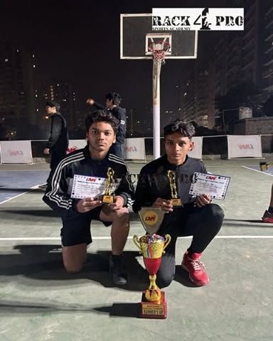 Two of our senior players from the U-17 category showcasing their trophies and certificates after the basketball winter league tournament. We train athletes to peak at competitive levels.
