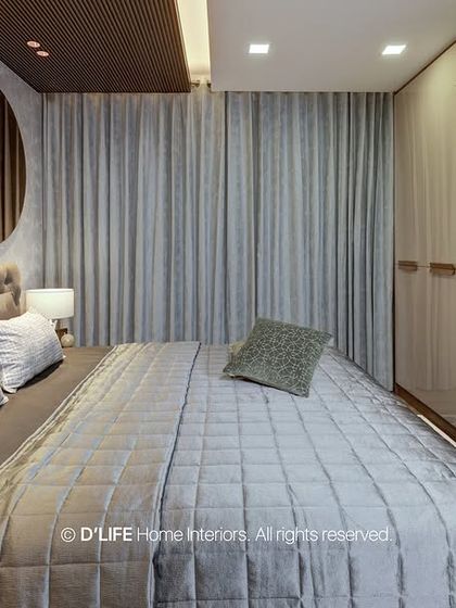 A view of the bedroom's sliding mirror wardrobe, which enhances the sense of space and adds a touch of modern luxury. The design cleverly integrates storage with style.