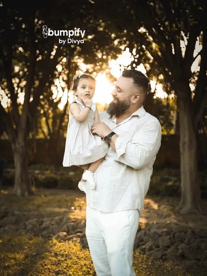 A father's love, illuminated by the golden hour sun. This tender moment between a dad and his daughter is what outdoor photography is all about.