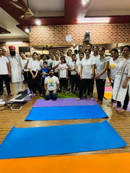 A happy group photo after our International Yoga Day session. It's always a joy to practice together as a community.