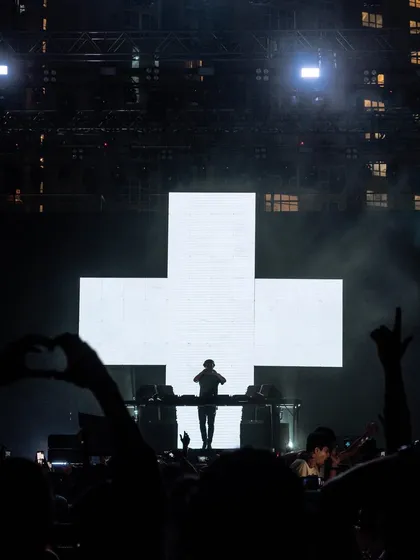 The iconic silhouette of Martin Garrix against his cross logo, a powerful and instantly recognizable image.