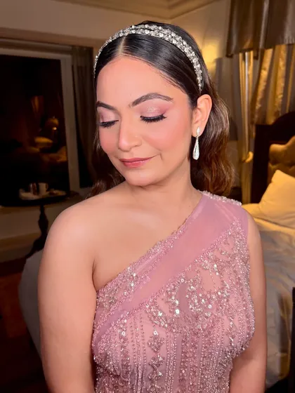 A close-up on the soft, rosy-tinted lids and delicate halo of shimmer. This eye look is all about creating a dreamy, romantic vibe.