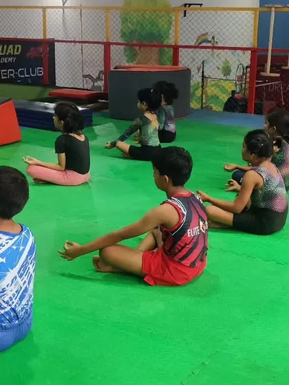 Our students practicing meditation. This helps them develop the mental fortitude required for competitive gymnastics.