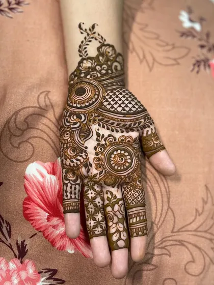 A little treat for a dear friend. This design features a mix of circular motifs and leafy patterns, with detailed work on each finger.