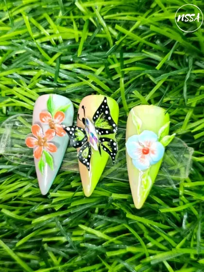 This vibrant 3D nail art with a butterfly and flowers is a testament to our students' creativity. They learn to sculpt and place these elements to create a balanced, eye-catching design.