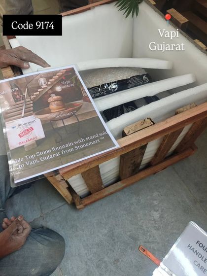 The packed tabletop fountain, seen here inside its wooden crate with foam supports. A picture of the final product is attached for easy identification.