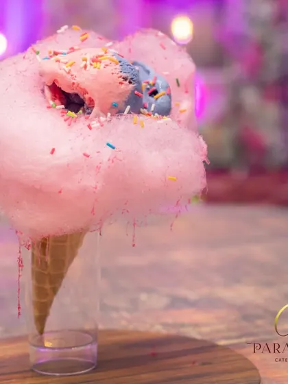 Iced Cotton Candy is like eating a cloud of happiness. We combine colorful ice cream with fluffy cotton candy for a whimsical dessert that delights kids and adults alike.