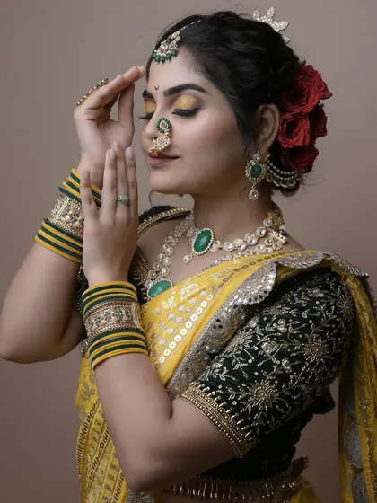 A close-up on the expressive eye makeup and traditional nath, demonstrating the student's skill in detailed application.
