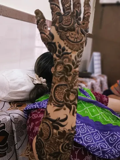 A side view of a detailed Dubai-style floral vine design. This style looks incredible as it wraps around the arm, creating a continuous flow of art.