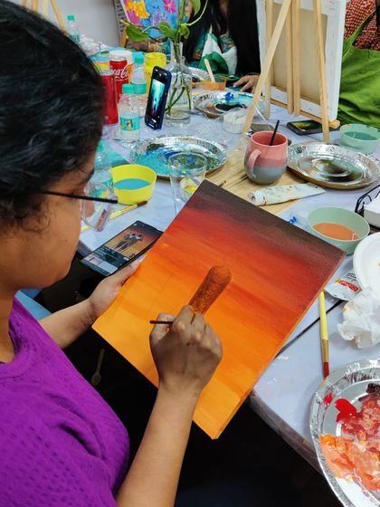 More scenes from our acrylic workshop for doctors, showing the focus and enjoyment as they mix colors and bring their canvases to life.