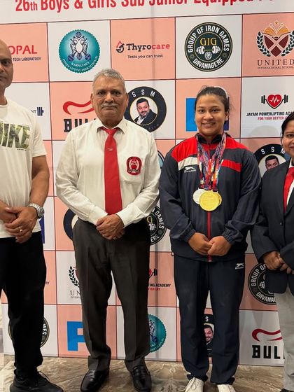 With my student Beena Parihar and officials at the Junior National Powerlifting Championship. She secured a gold medal and set two new national records.