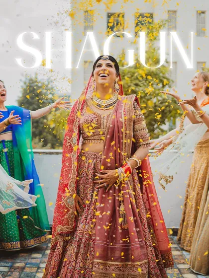 A joyful shot of the bride being showered with yellow flower petals by her bridesmaids.