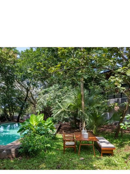 An alfresco dining spot at the 'Villa in a Grove'. Life is lived out of doors here, amidst the cacophony of birds and the rustle of leaves.