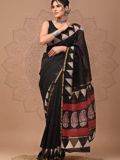A black pure Chanderi cotton silk saree with a traditional temple and paisley hand block print on the pallu.