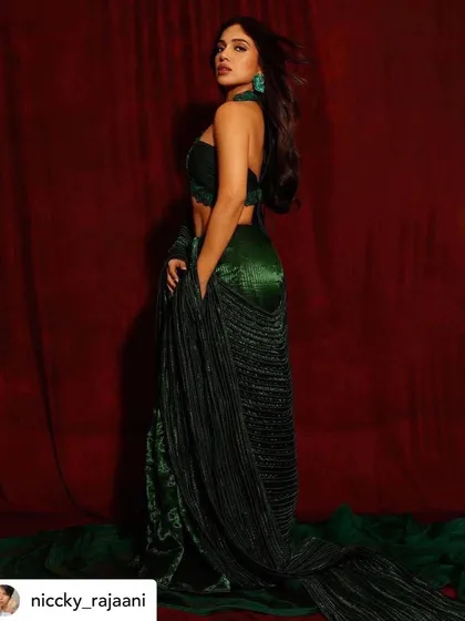 A full-length view of Bhumi's sustainable and artistic red carpet look. The makeup was kept elegant and glowing to match the overall aesthetic.