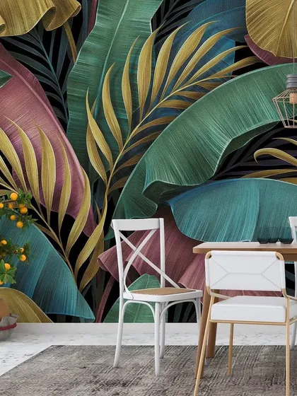 This dining area is brought to life with a colorful tropical leaf wallpaper. The mix of pink, teal, and gold leaves against a dark background is both playful and chic.