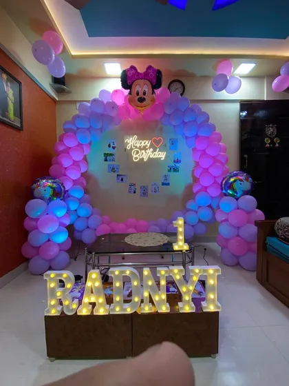 The Minnie Mouse home decoration under blue lighting, creating a different mood for the party.