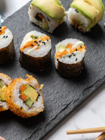 A beautiful platter of assorted sushi, showcasing the variety I can offer. From creamy avocado rolls to crispy tempura rolls, there's something to please every sushi lover.