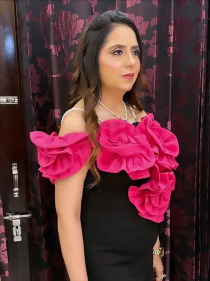 A side profile of this stunning party look. The makeup is blended perfectly to look flawless from every angle.
