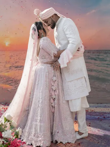 A romantic embrace as the sun sets over the ocean. We believe in creating epic, breathtaking portraits that feel like a scene from a movie, capturing the magic of your love story against a stunning backdrop.